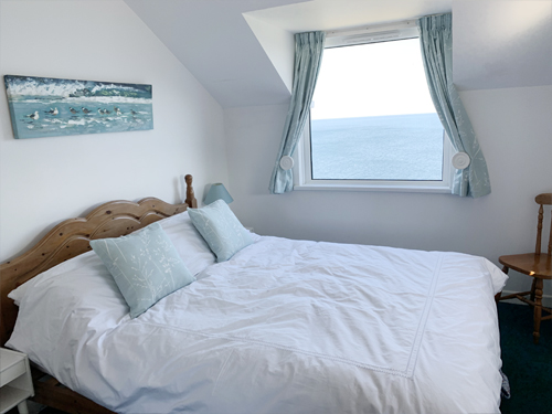 Clifftops  main  Bedroom  with sea Views over the entrance to Port Isaac Harbour