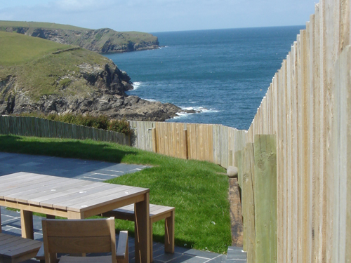 View along garden across the entrance to Port Isaac harbour